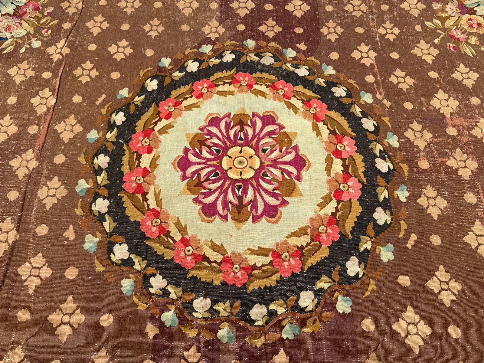 Charles X Aubusson Carpet, 12ft 1in x 10ft 4in: A French 19th C. Charles X Aubusson carpet with a central floral medallion and alternating foliate and roundels on an earth-tone ground. 12ft 1in x 10ft 4in. | You have additional shipping options,