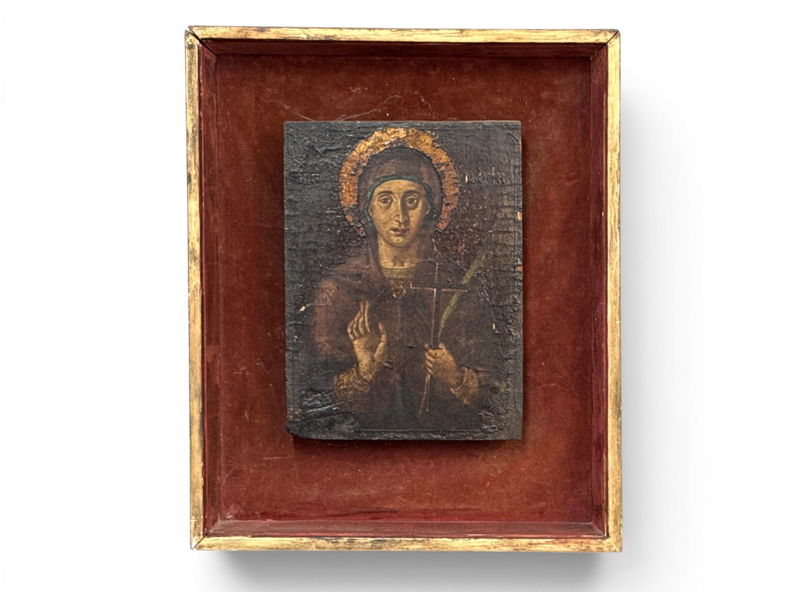 Religious Orthodox Painted Icon: Saint Paraskevi: A religious Orthodox painted icon on panel depicting Saint Paraskevi. Float mounted onto a velvet-backed wood frame. Panel: 13-1/4in tall x 10in wide. Outside frame: 21-3/4in x 18in. | You have additi