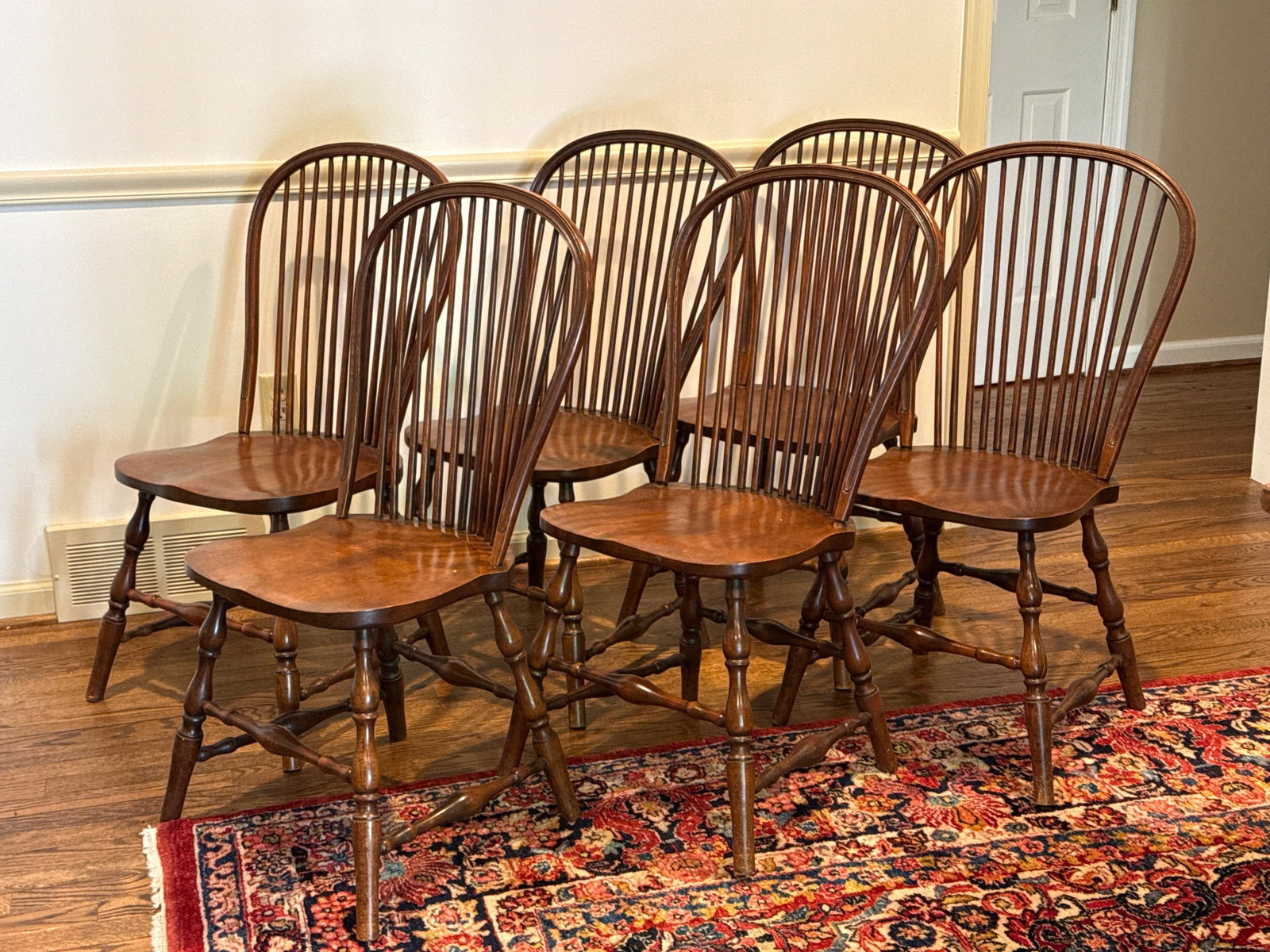 Six Bow-Back Windsor Side Chairs: A set of six bow-back Windsor dining chairs with spindle backs. 20th C. Unmarked. Each: 36in tall x 20in wide x 17in deep. | You have additional shipping options, and are not required to use Live