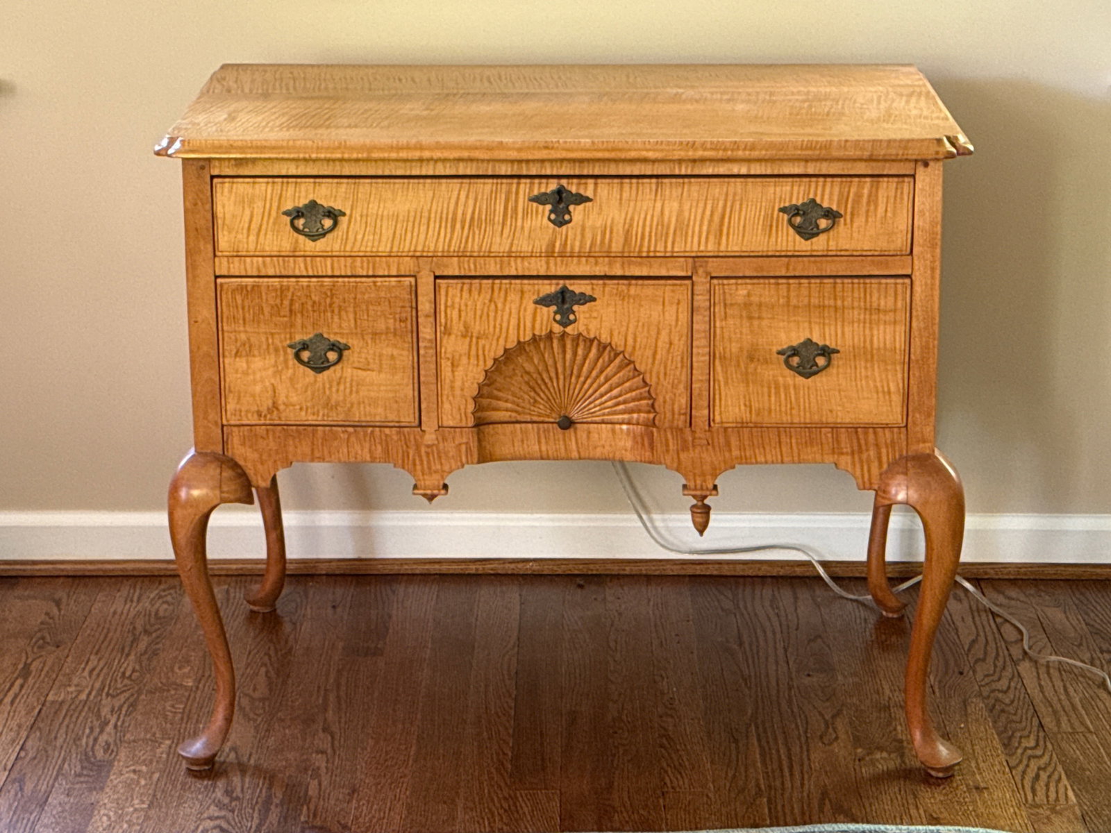 Queen Anne-style Tiger Maple Dressing Table: A Queen Anne-style tiger maple dressing table or lowboy, circa 20th C. 29in tall x 35in wide x 19-3/4in deep. Lacking drop finial and with splitting to case as shown. | You have additional shipping