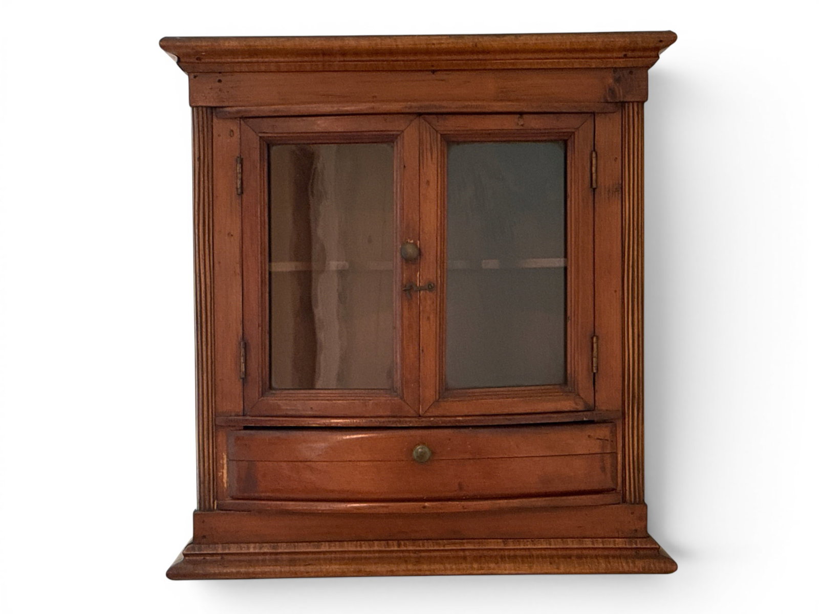 Country Pine Counter-Top Cabinet: A 19th C. country pine counter top or wall cupboard having two glass doors and a lower drawer with open secret compartment underneath. 19in tall x 18in wide x 11 in deep. | You have additional shippin