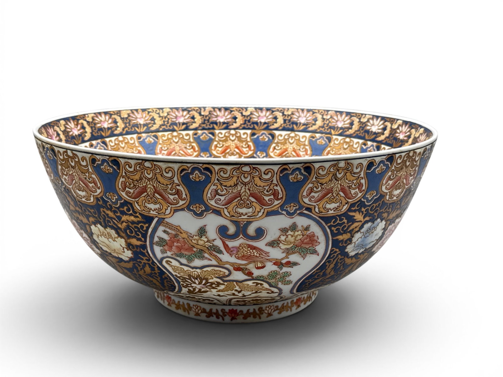 Contemporary Japanese Imari Punch Bowl: A contemporary Japanese Imari bowl having cobalt blue background with gilt decorated botanical motif. 7-1/2in tall x 16in wide. | You have additional shipping options, and are not required to use Live
