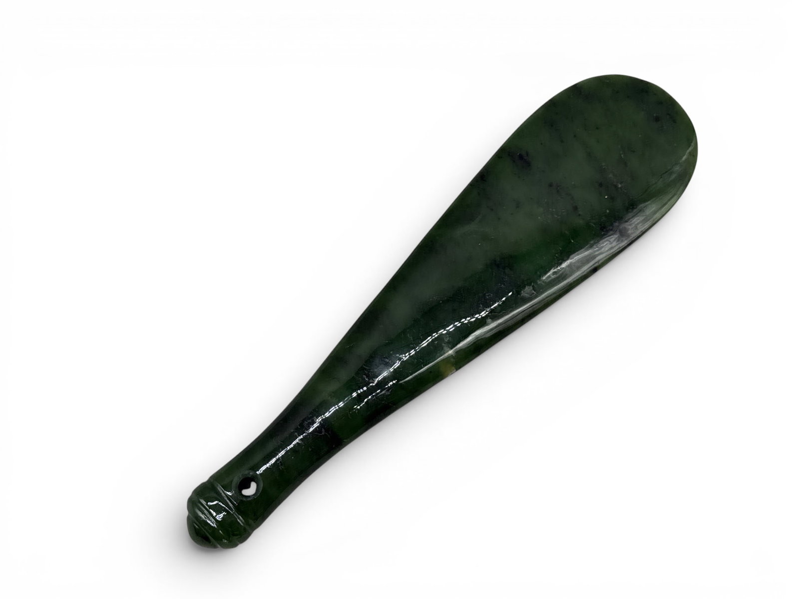 Late 19th C. Maori Mere Pounamu: A late 19th C. Maori mere pounamu comprised of shaped, green hardstone. 1-/2in tall x 10in wide. | You have additional shipping options, and are not required to use Live Shipping. Additional shipping