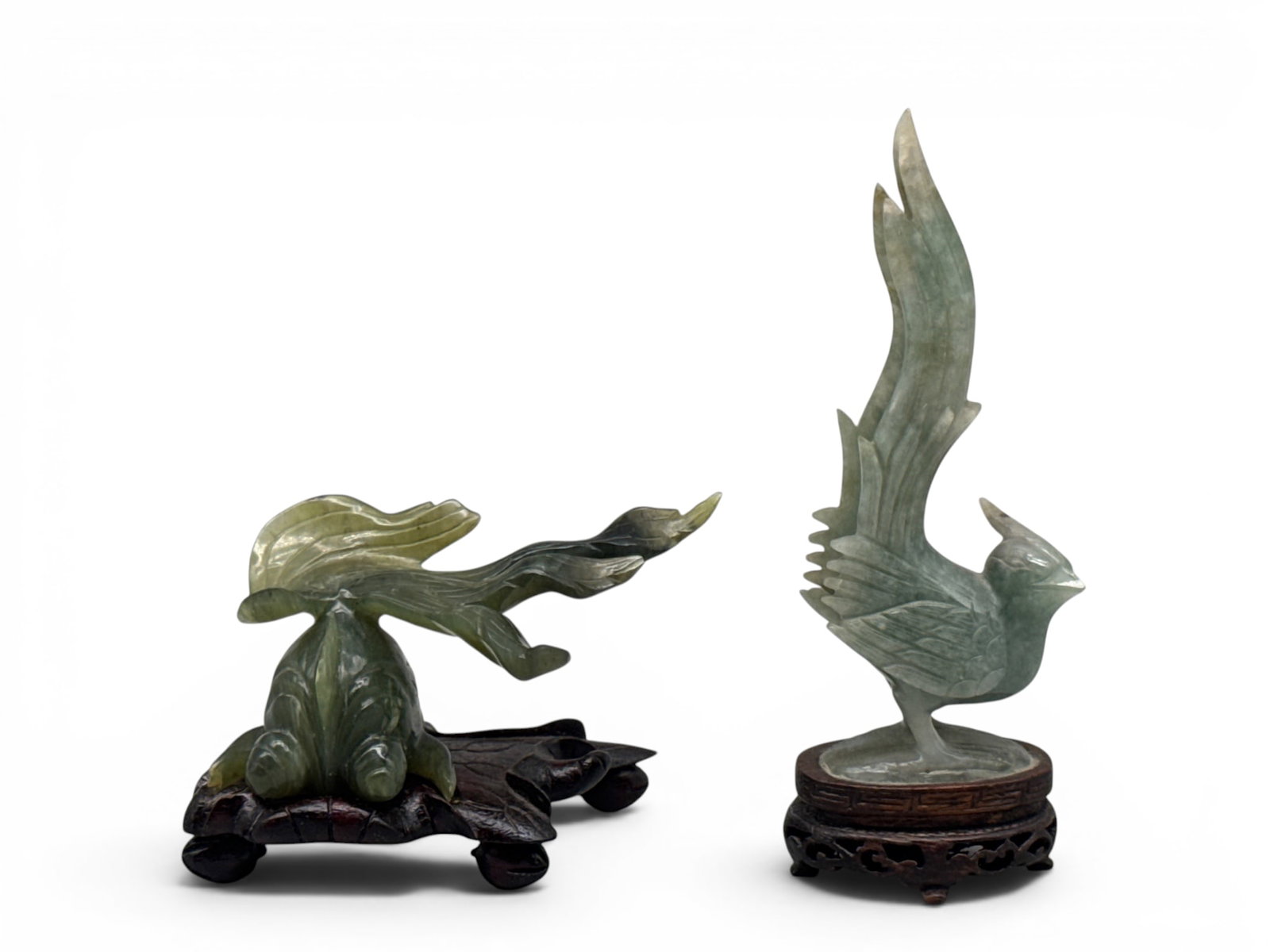 Chinese Carved Jade Goldfish and Phoenix: Chinese carved jade goldfish resting on carved rosewood stand and a carved jade phoenix resting on intricately carved hardwood stand. Larger: 5in tall x 2in wide. | You have additional shipping