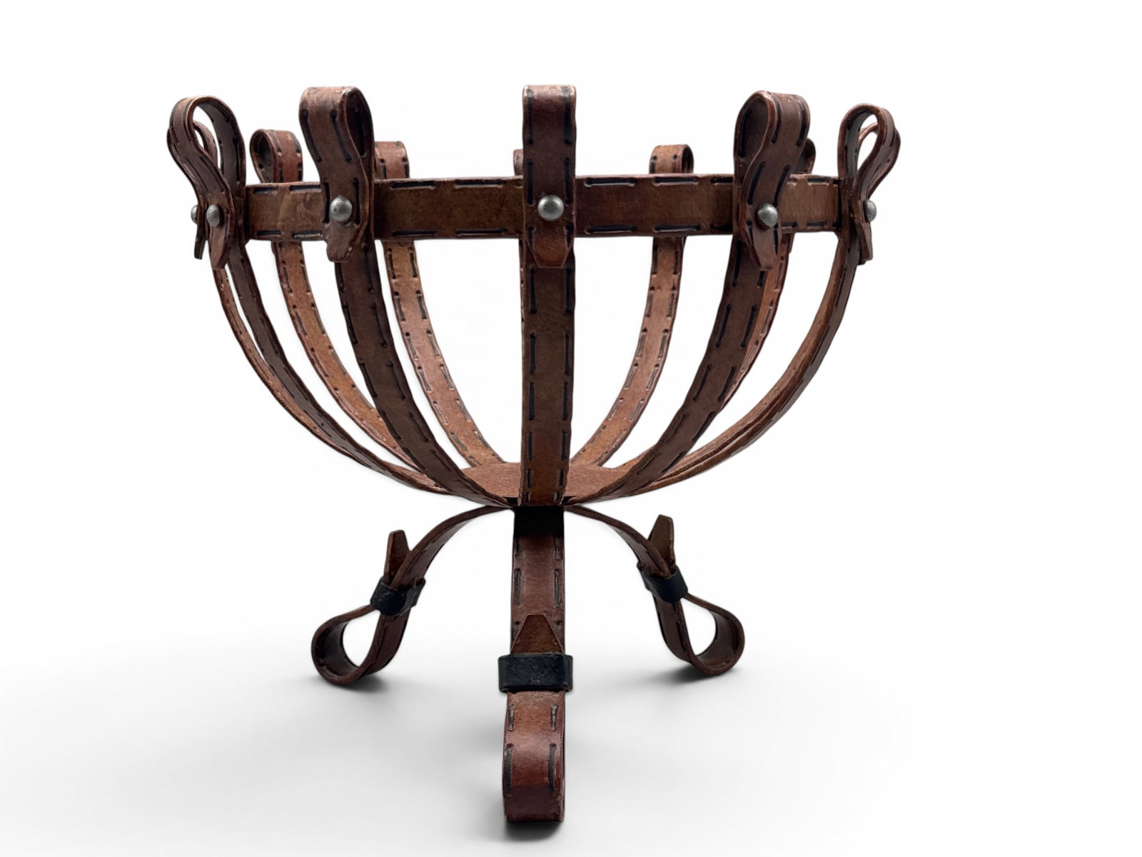 Equestrian Forged Iron Fruit Basket: An Equestrian themed fruit basked in forged iron having realistic leather design with painted whipstitch and grommet detail in the form of horse reins. 11in tall x 13in wide. | You have additional shi