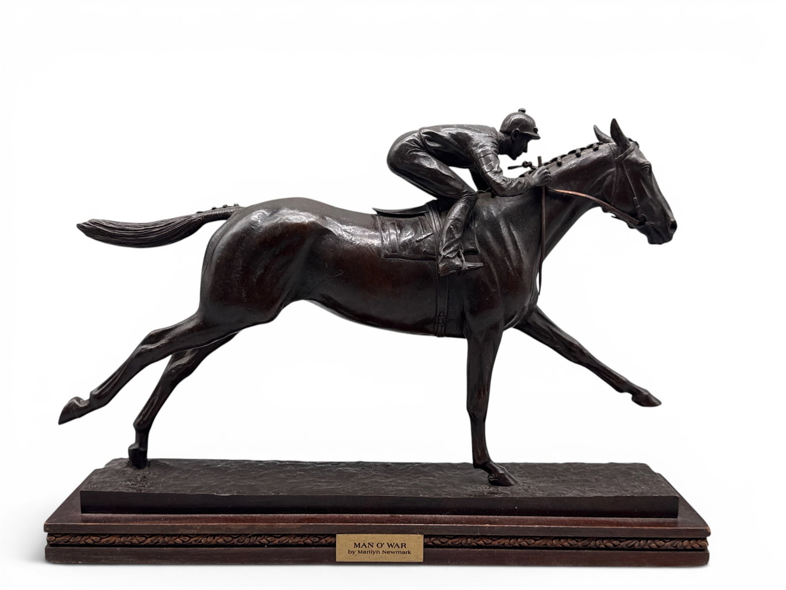 Marilyn Newmark. Bronze: Man O'War: Marilyn Newmark (American, 1928-2013) A bronze equestrian sculpture titled "Man O'War" with a jockey on horseback. Signed and dated. Attributed on plaque. 11in tall x 15in wide. | You have additional 
