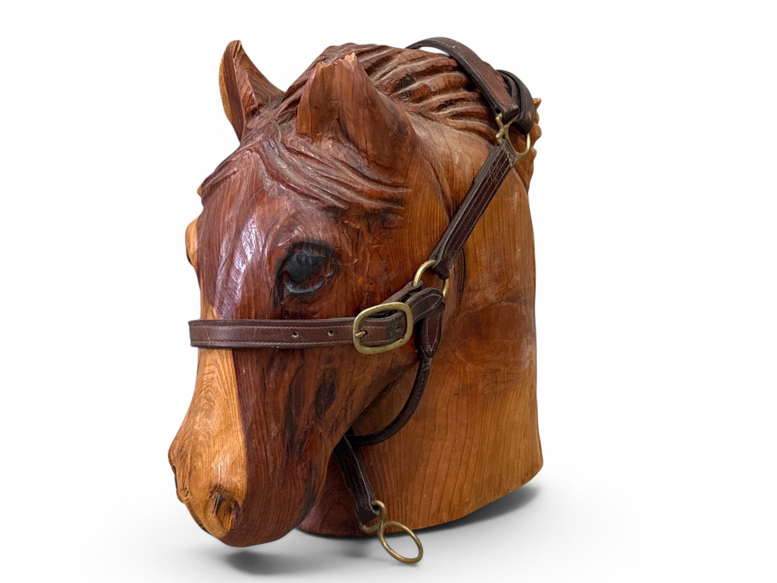 Carved Wood Horsehead Sculpture: A carved wood sculpture depicting a horsehead in Roxette Hanover leather reigns. 21in tall x 16in wide. | You have additional shipping options, and are not required to use Live Shipping. Additional sh