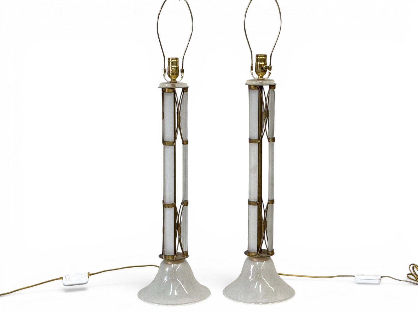 Pair of Hollywood Regency Glass and Brass Table Lamps: Pair of frosted and clear glass Hollywood Regency table lamps mounted in brass frames. Bases: 25in tall. | You have additional shipping options, and are not required to use Live Shipping. Additional s