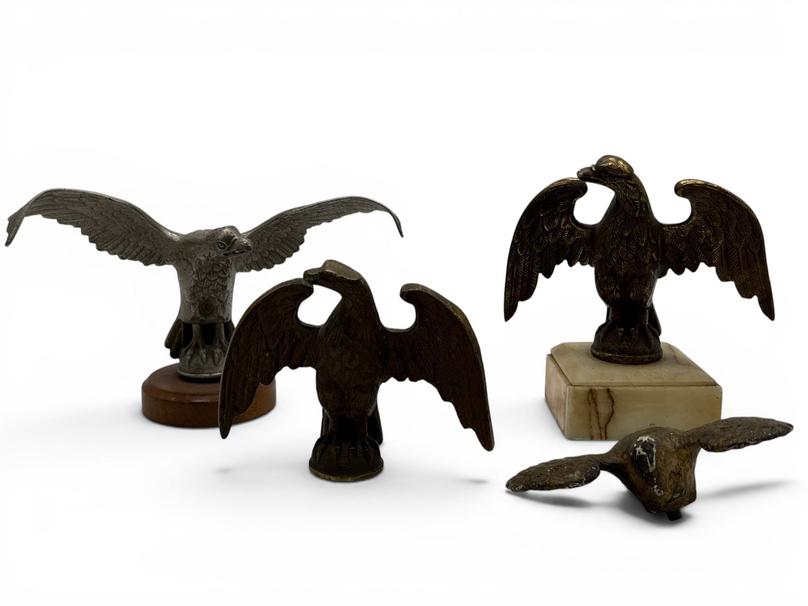 Four American Eagle Form Finials: A grouping of four American eagle form finials and sculptures. Eagle on marble base: 7in tall x 7in wide. | You have additional shipping options, and are not required to use Live Shipping. Additional 