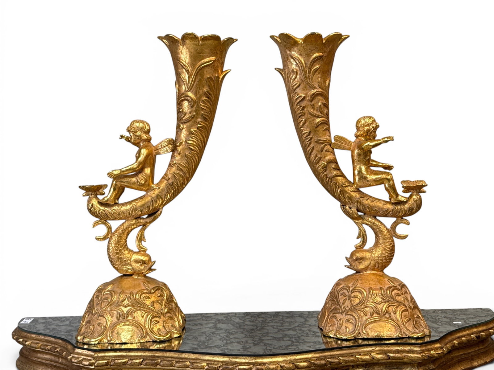 Large Scale Gilt Bronze Cherubic Horn Vases: A large scale pair of gilt bronze vases of horn form with dolphin bases and cherub figures. 31in tall x 16in wide x 11 in deep. | You have additional shipping options, and are not required to use Live