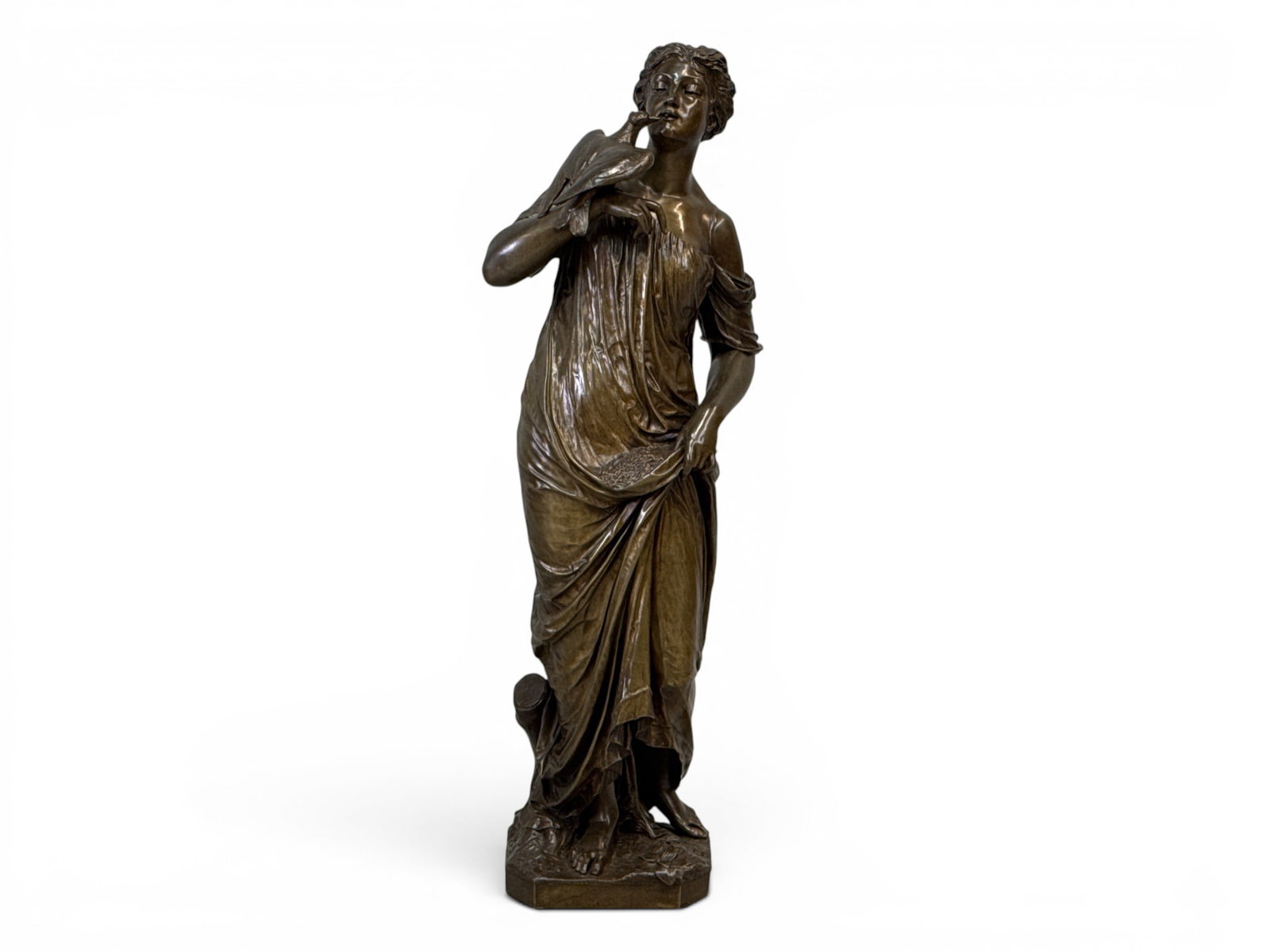 C. Fischer Bronze Sculpture. Woman with Dove: A patinated bronze sculpture of a woman in classical dress holding a dove, signed along base C. Fischer F. 34in tall. | You have additional shipping options, and are not required to use Live Shipping.
