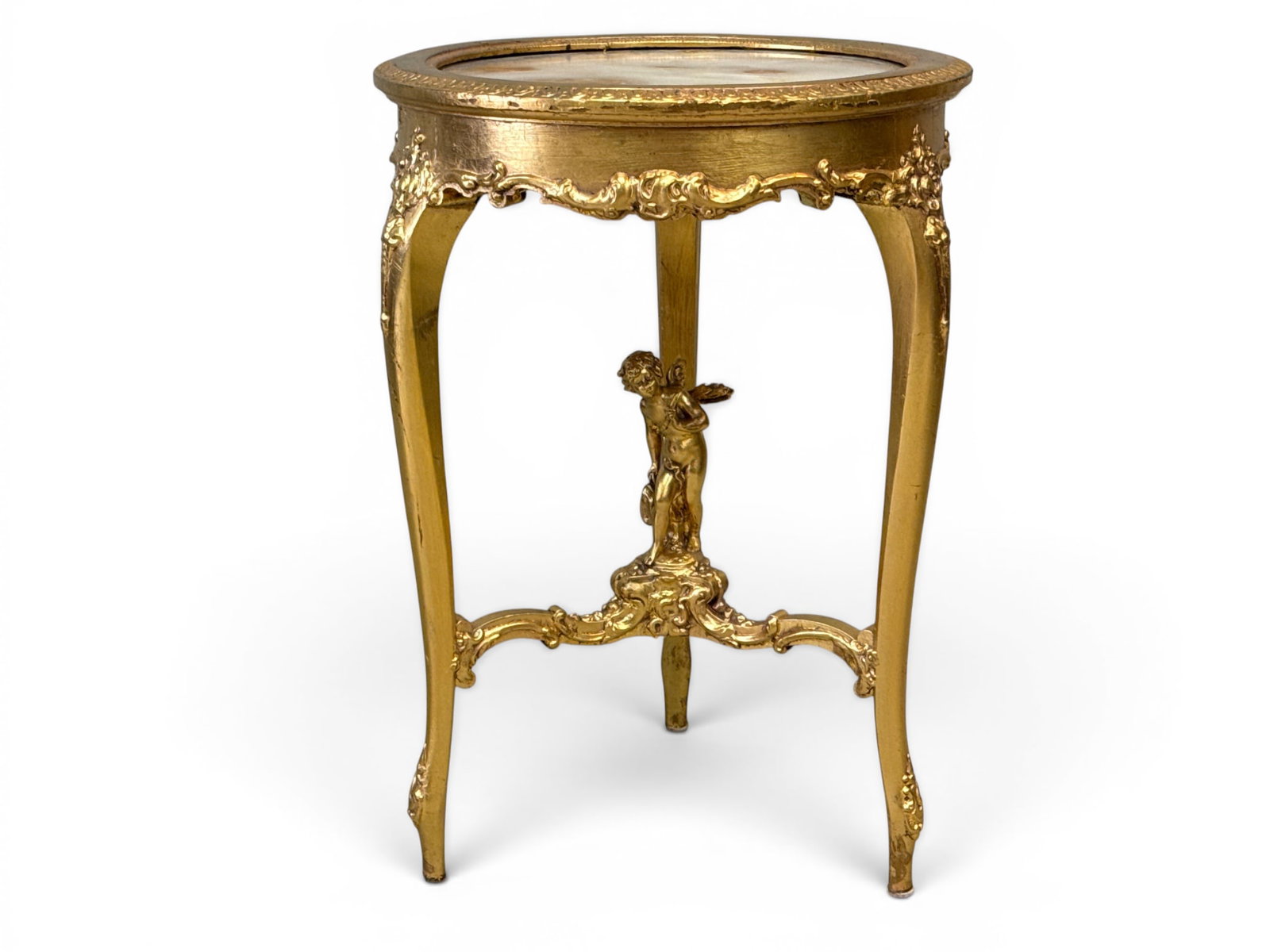 French Louis XV-style Marble Top Stand: A French Louis XV-style marble top giltwood stand having cabriole legs joined by a cherub figural capped stretcher. 29in tall x 20-1/2in wide. | You have additional shipping options, and are not requi