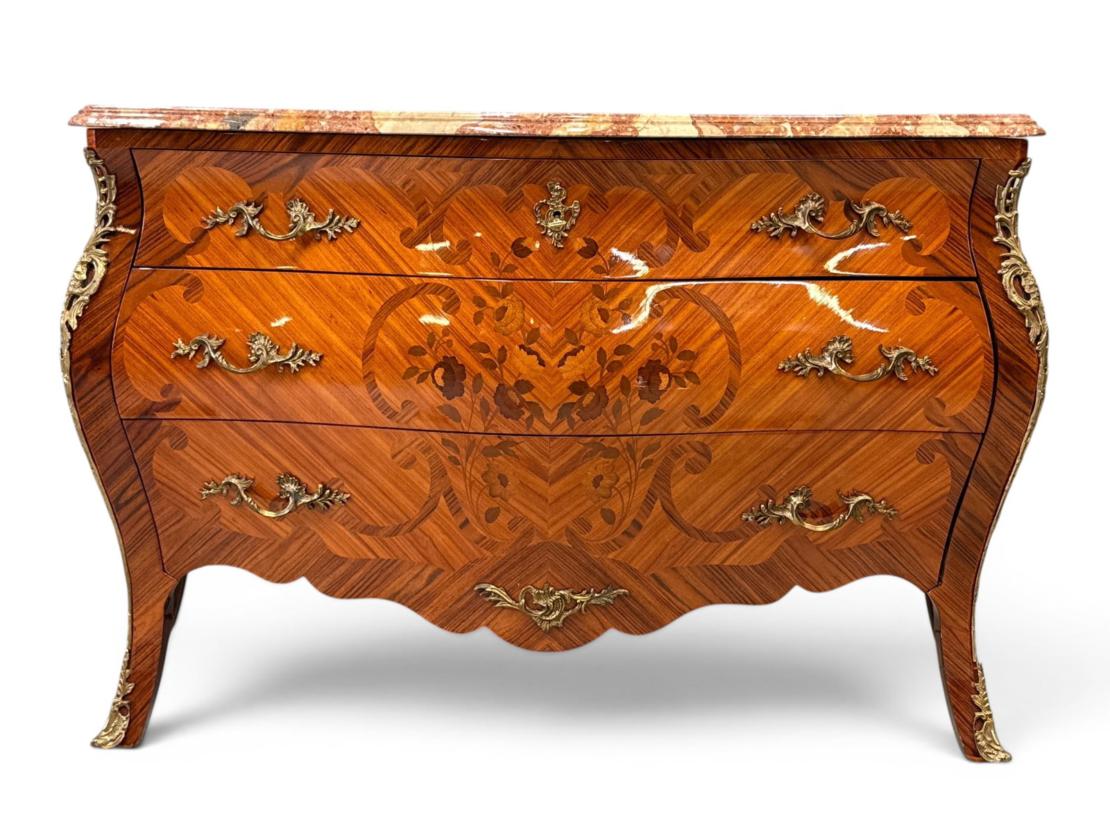 French Louis XV-style Marble-Top Commode: A French Louis XV-style commode of bombe form with a floral marquetry inlaid case, marble top, and ormolu mounts. 34-1/2in tall x 55in wide x 22 in deep. | You have additional shipping options, and ar