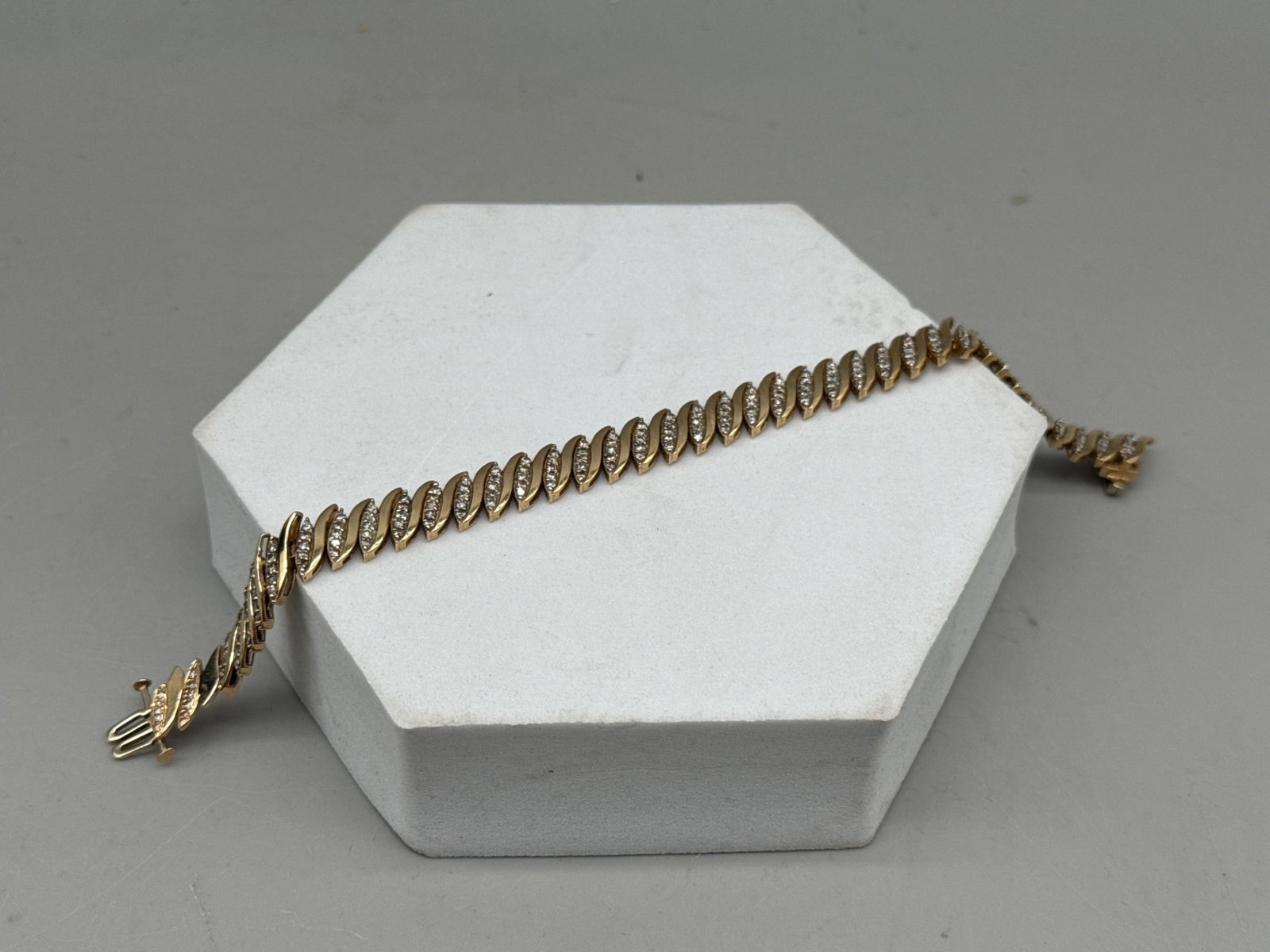14K Chevron Bracelet with Diamonds: A 14K chevron-patterned bracelet with inset diamonds. Marked 14K. 8in long. 13.43 dwt. | You have additional shipping options, and are not required to use Live Shipping. Additional shipping and delive
