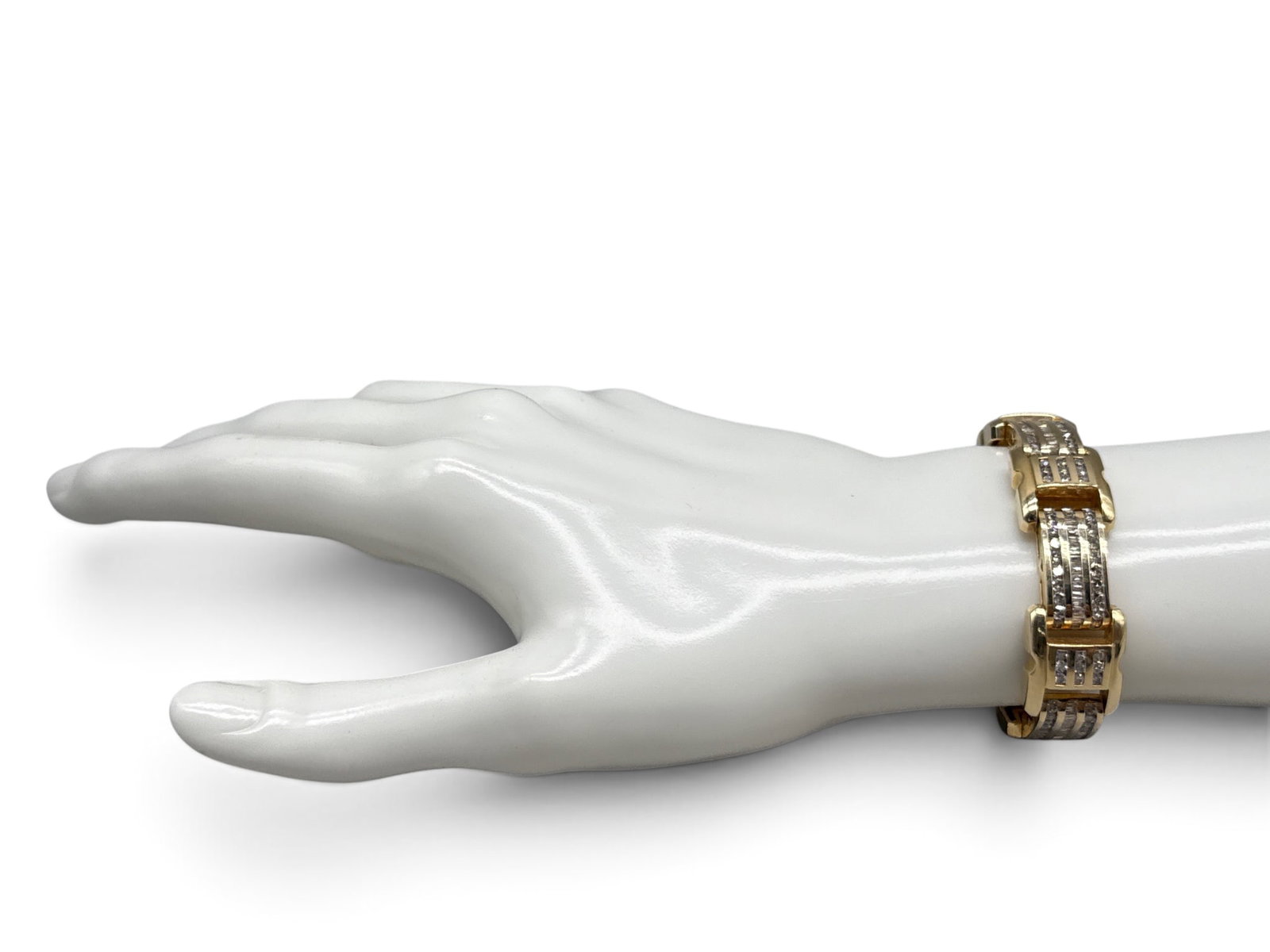 14K Men's Channel Set Diamond Bracelet: A Men's 14K yellow gold chain bracelet with channel set round and baguette diamonds. Marked 14K. 8in long. 41.79 dwt. | You have additional shipping options, and are not required to use Live Shipping.