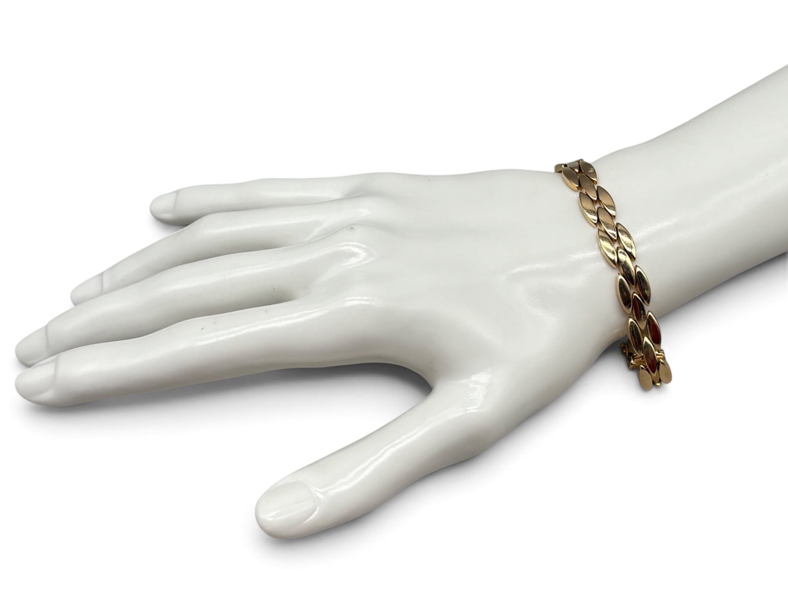 Tiffany & Co. 14K Panther Link Bracelet: A Tiffany & Co. 14K yellow gold panther link bracelet. Marked Tiffany & Co, 585 on clasp. Circa 1990. 8in long. 11.57 dwt. | You have additional shipping options, and are not required to use Live Ship