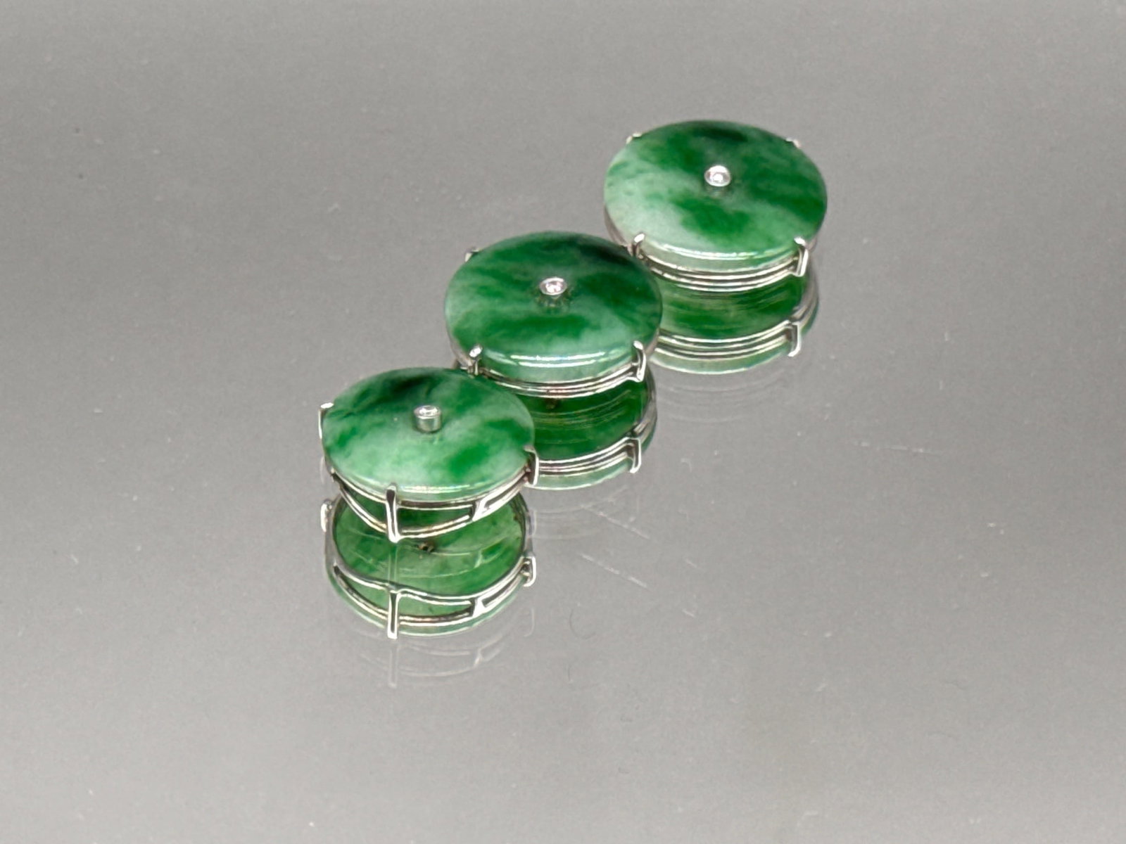 18K Jade Disc and Diamond Pendant: An 18K white gold-mounted pendant with three jade discs inset with diamonds. Marked 18K. 3.85 dwt. | You have additional shipping options, and are not required to use Live Shipping. Additional shippin