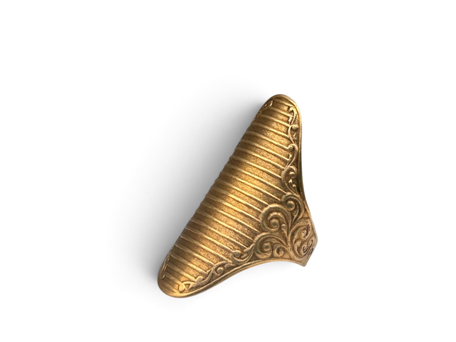 14K Victorian Shield-Form Finger Guard: A 14K yellow gold Victorian finger guard of shield form with ridged top and swirling border. Marked 14K. 1-1/8in tall x 3/4in wide. 2.18 dwt. | You have additional shipping options, and are not requir