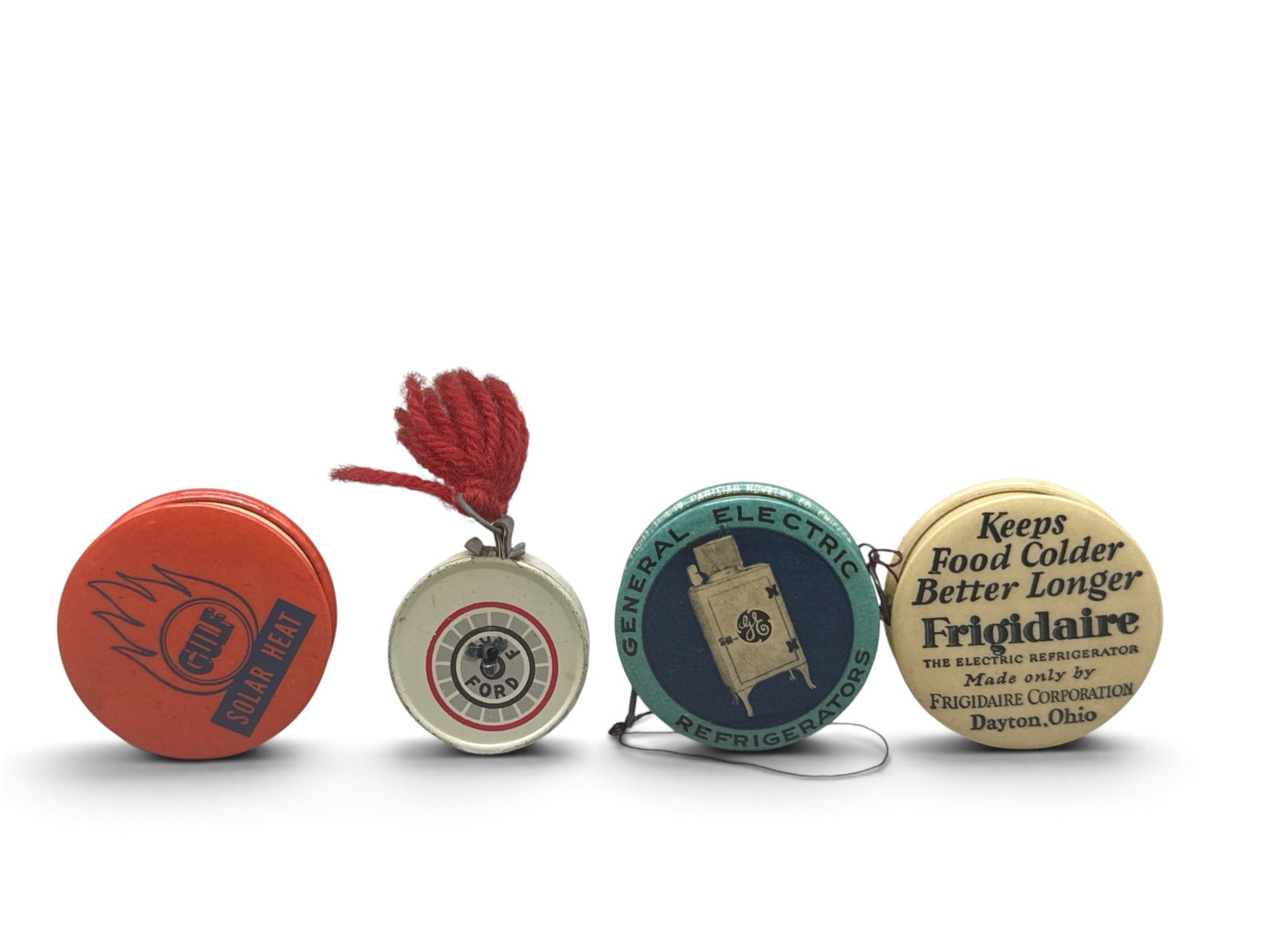 Four Celluloid and Tin Advertising Tape Measures (1 of 9)