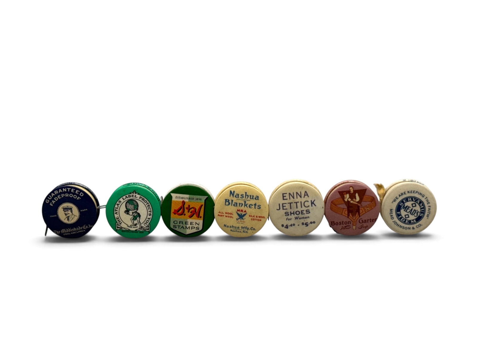 Seven Celluloid Advertising Tape Measures: To include Middishade Co. Inc. Philadelphia; H. Kohnstamm & Co., NY and Chicago; S. & H. Green Stamps; Nashua Mfg. Co, Nashua, NH; Enna Jettick Shoe Store, Harrisburg, PA; Boston Garter; and Mead