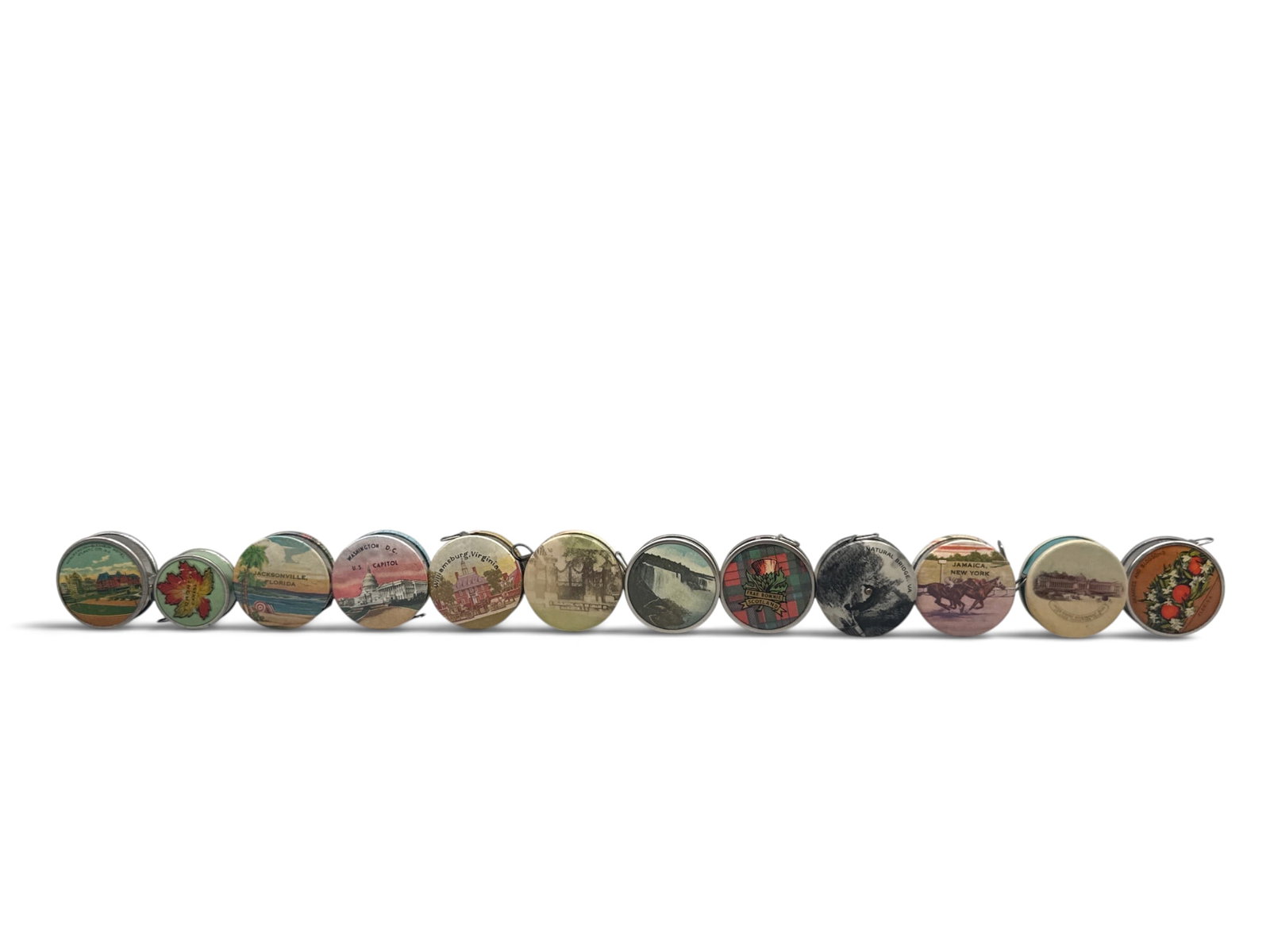 12 Souvenir Celluloid and Metal Tape Measures: Twelve souvenir tape measures of celluloid and metal with push button release. Largest: 1-1/2in diameter. | You have additional shipping options, and are not required to use Live Shipping. Additional