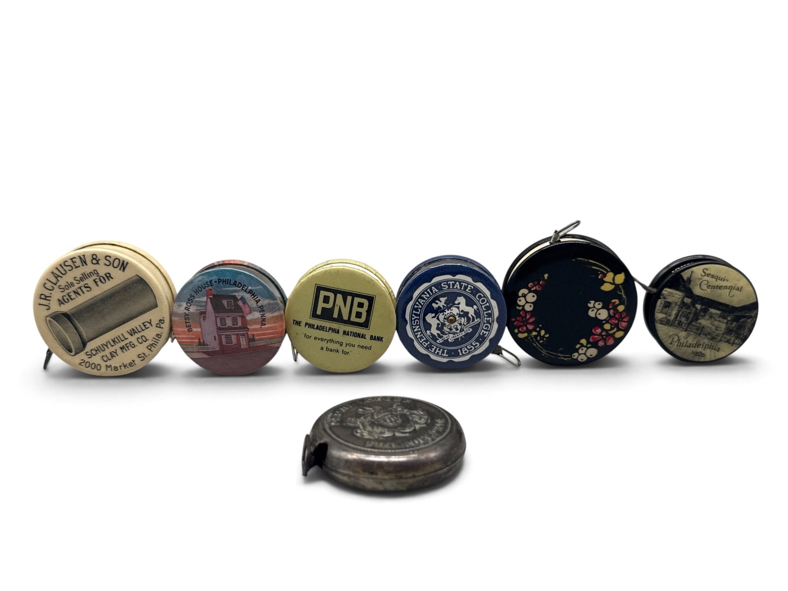 Seven Pennsylvania Advertising/Souvenir Tape Measures: Grouping to include Ed Werner of Pittsburgh, Works Shoemakersville of Berks Co, The Philadelphia National Bank, The Pennsylvania State College, The Betsy Ross House, Philadelphia Sesqui-Centennial