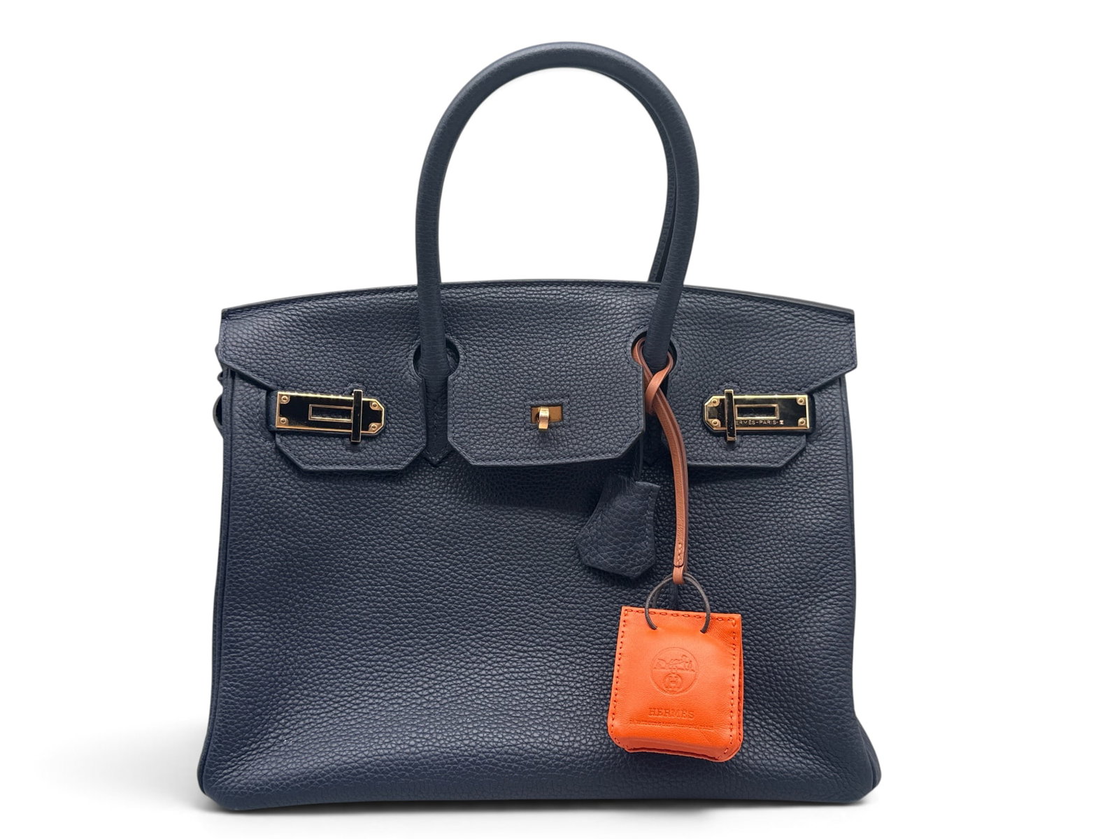 Hermes Birkin 30 Bleu Nuit Togo Leather Handbag: An Hermes Birkin 30 Bleu Nuit handbag in Togo leather with gold hardware closures, interior is lined with navy blue leather and features engraved Hermes zipper. Exterior is marked Hermes Paris. Includ