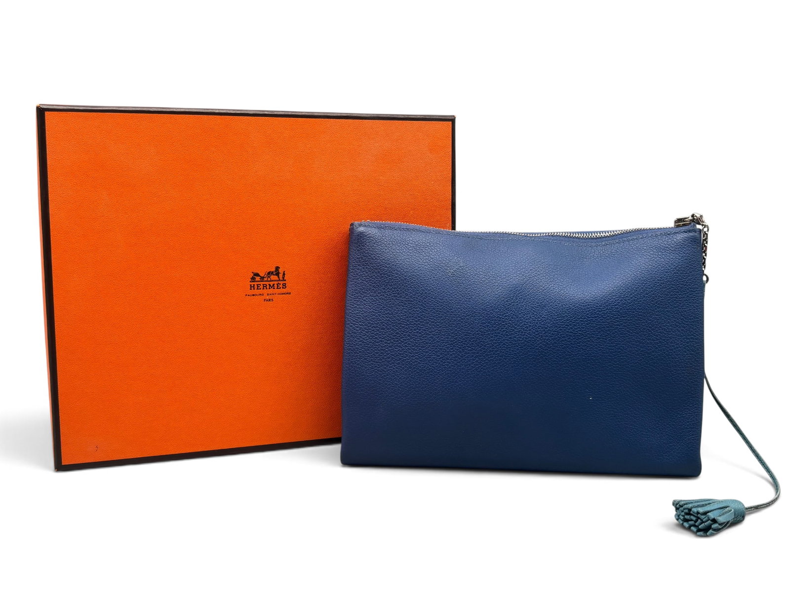 Hermes Evercolor Atout 20 Leather Pouch: An Hermes Evercolor Atout 20 leather pouch with palladium plated hardware, black leather lining, dual internal compartments, and zip closure. Interior is marked Hermes. Includes blue leather Hermes ta