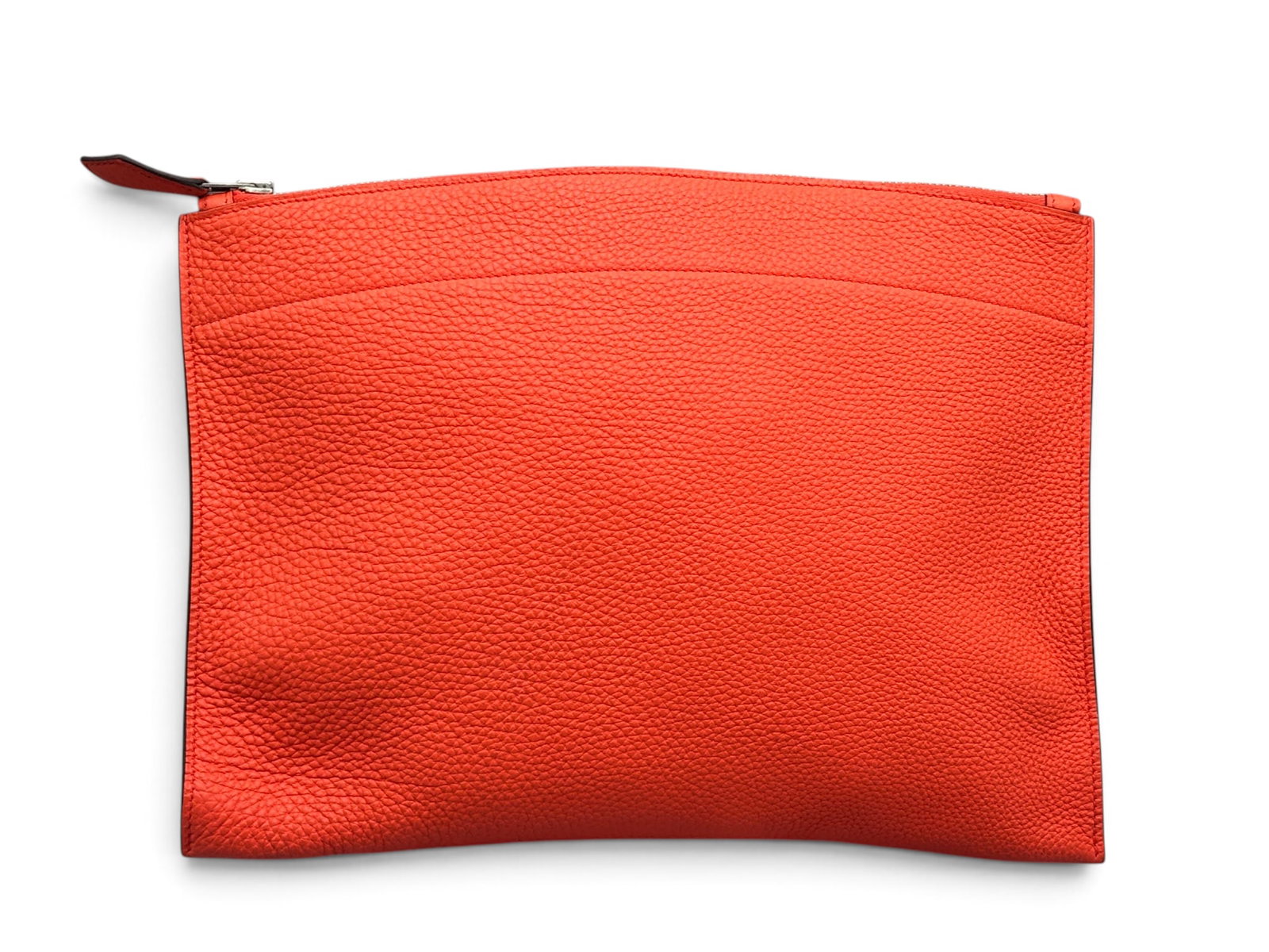 Hermes Pochette Bazar MM Orange Poppy: An Hermes Pochette Bazar MM Veau Clutch in orange poppy Togo leather with suede-lined interior and top zip closure. Marked Hermes. Includes original dust cloth and receipt circa 2015. 9in tall x 12in 