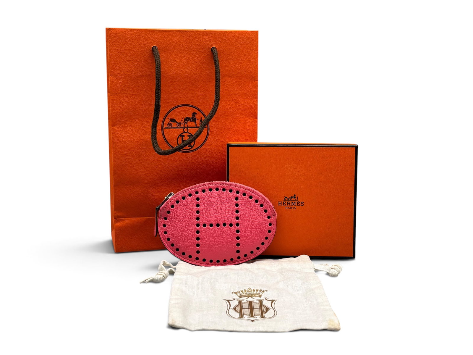 Hermes Porte-Monnaie Evelyn Chevre Coin Purse: An Hermes Paris Porte-Monnaie Evelyn Chevre coin purse in U5 Rose lipstick Mysore goatskin leather. Marked Hermes. Includes Hermes box, bag, dust cloth and original receipt circa 2013. 3in tall x 4-1/