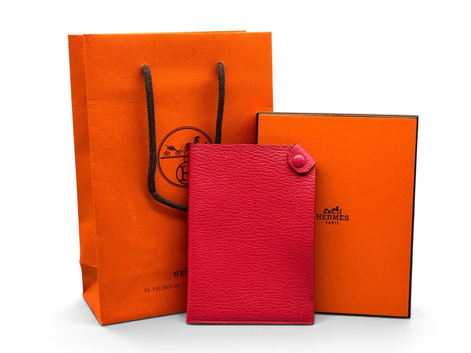 Hermes Tarmac Leather Passport Holder: An Hermes Tarmac PM leather passport holder in hot pink with snap closure. Marked Hermes. Includes Hermes box and bag. 5-1/2in tall x 4in wide. | You have additional shipping options, and are not requ