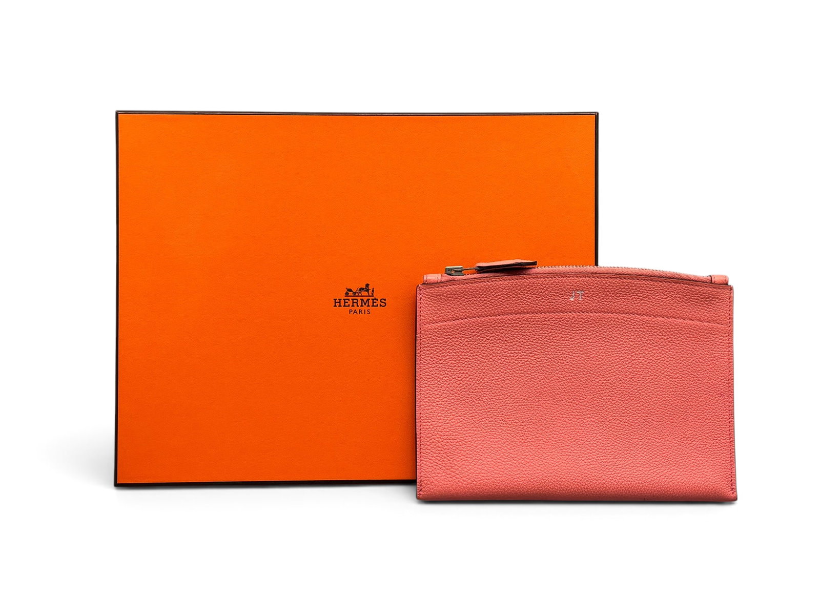 Hermes Pochette Bazar MM Clutch: An Hermes Pochette Bazar MM Clutch in pink Togo leather with suede-lined interior and top zip closure. Marked Hermes. Includes Hermes box. 6in tall x 8in wide. | You have additional shipping options, 