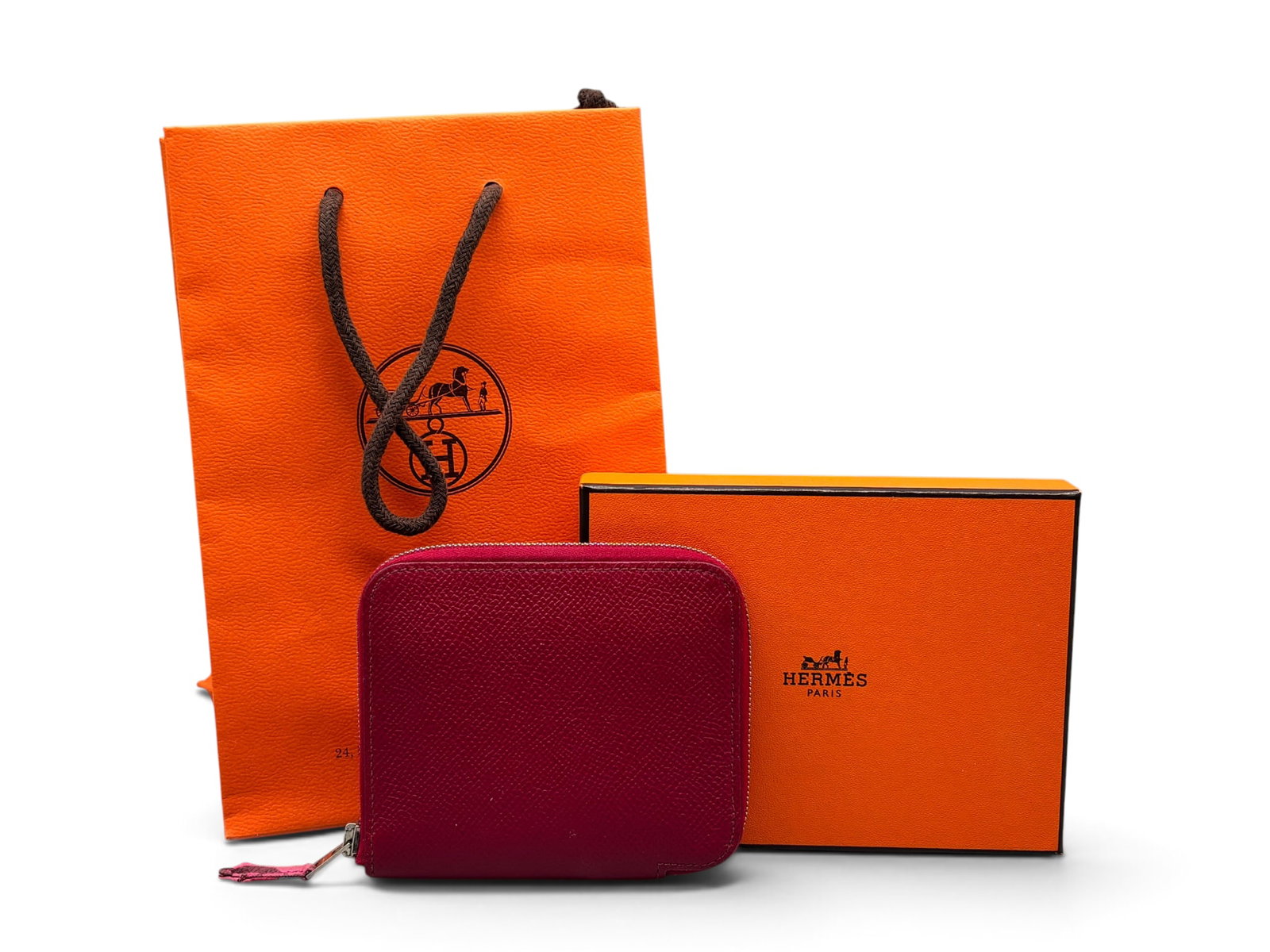 Hermes Azap Zip-Around Compact Wallet: An Hermes Azap zip-around compact wallet in Epsom pink leather with multi-colored, equestrian-themed, silk scarf-pocketed interior. Marked Hermes. Includes Hermes box and bag. 4in tall x 4-1/2in wide.