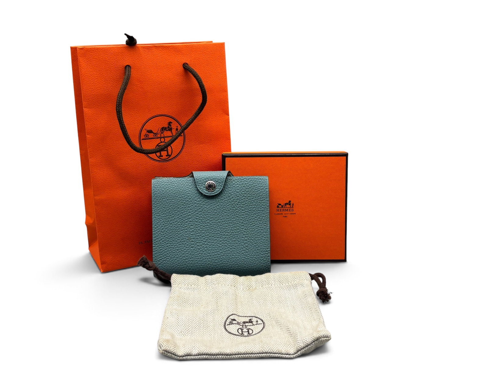 Hermes Ulysses PM Mini Notebook Cover: An Hermes Paris Ulysses PM mini notebook cover in ciel togo calfskin with palladium hardware, marked Hermes, with mini Arpege notebook, Hermes box, dust cloth and bag. Circa 2011, with original receip