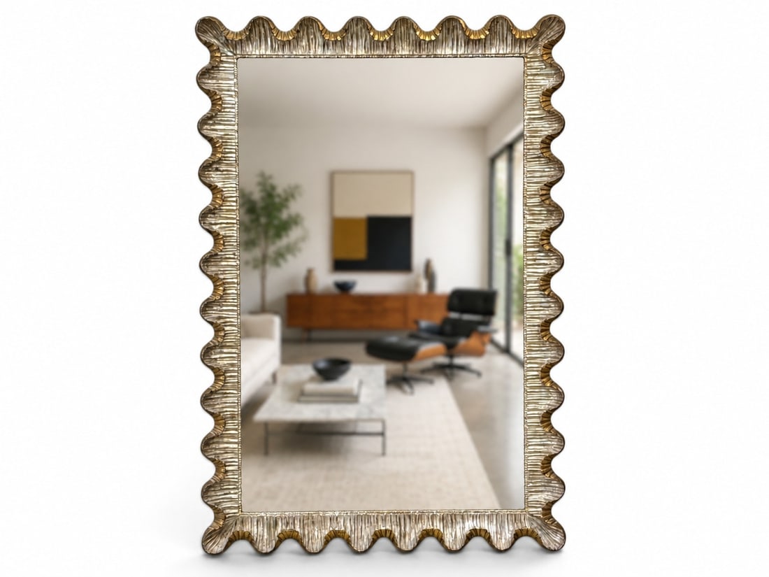 Italian Scalloped Giltwood Wall Mirror: An Italian wall mirror in a gilt- and silvered-wood frame with a carved scalloped design. Stamped and with label on verso. 51in x 35in. | You have additional shipping options, and are not required to 