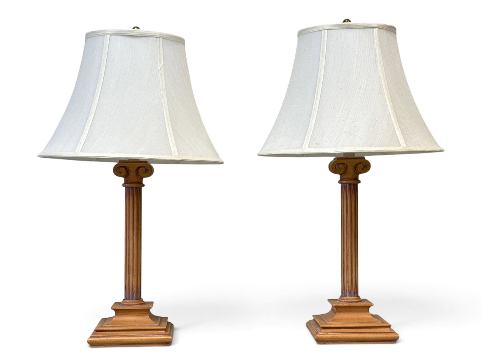 Pair of Ionic Column-Form Table Lamps: A decorator pair of Ionic column-form table lamps, 20th C., painted metal. Height to finials: 27-1/2in. | You have additional shipping options, and are not required to use Live Shipping. Additional sh