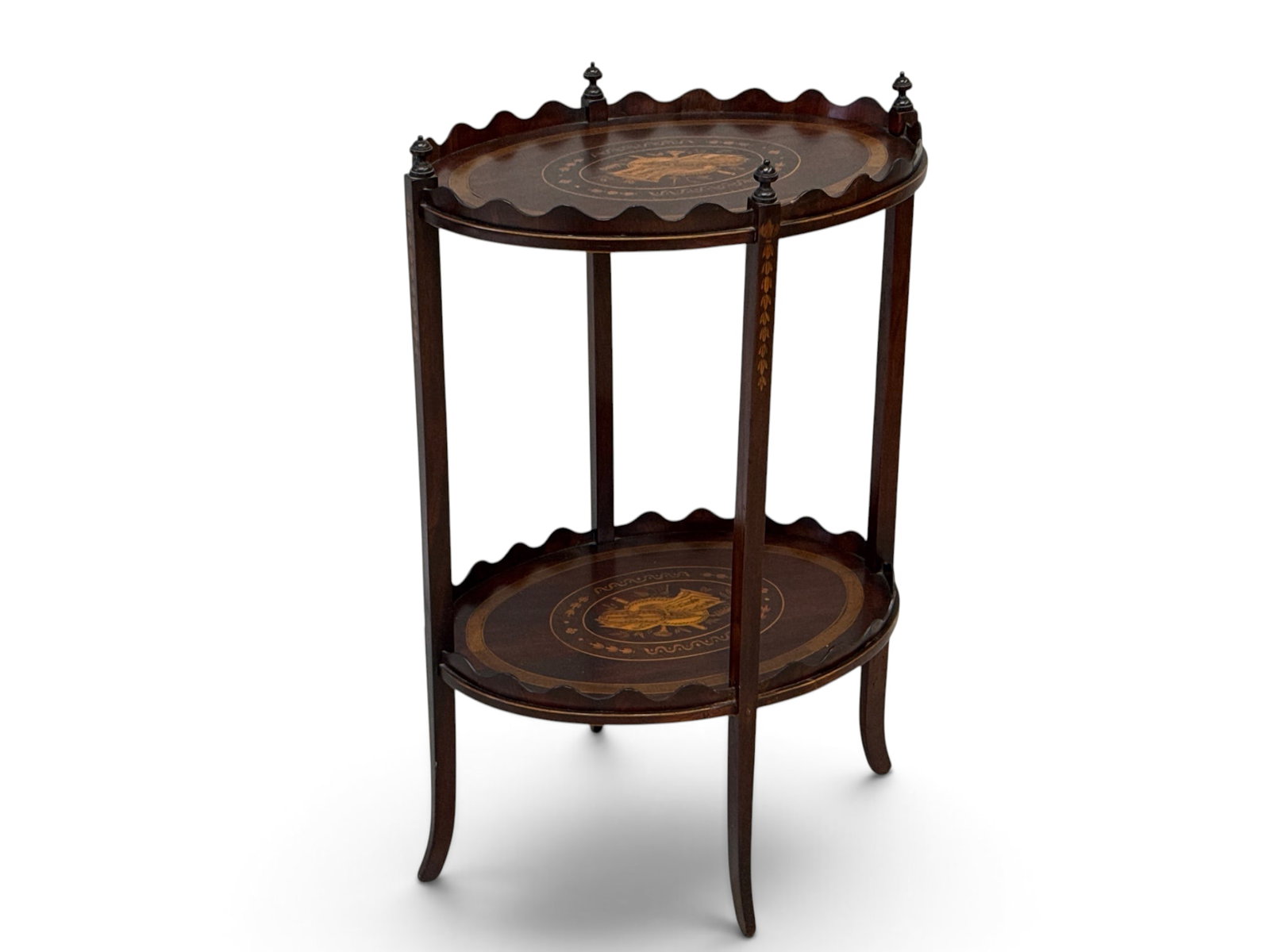 Edwardian Inlaid Mahogany Two-Tiered Occasional Stand: An Edwardian two-tiered mahogany occasional stand with scalloped gallery rails, inlaid with musical panel designs. 32-1/4in tall x 21in wide x 15-1/2in deep. | You have additional shipping options, an