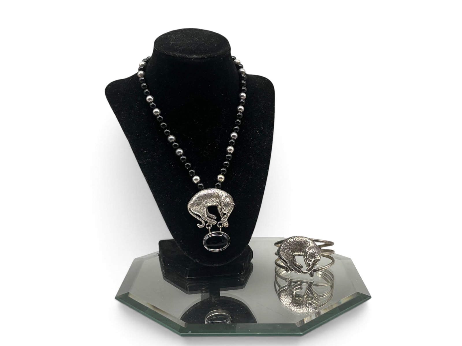 Carol Felley Sterling Leopard Pendant and Cuff: A Carol Felley onyx and silver hand-beaded necklace with leopard-form pendant mounted with onyx, together with a include a leopard-form cuff. Each signed. 73.81 dwt total. | You have additional shippi