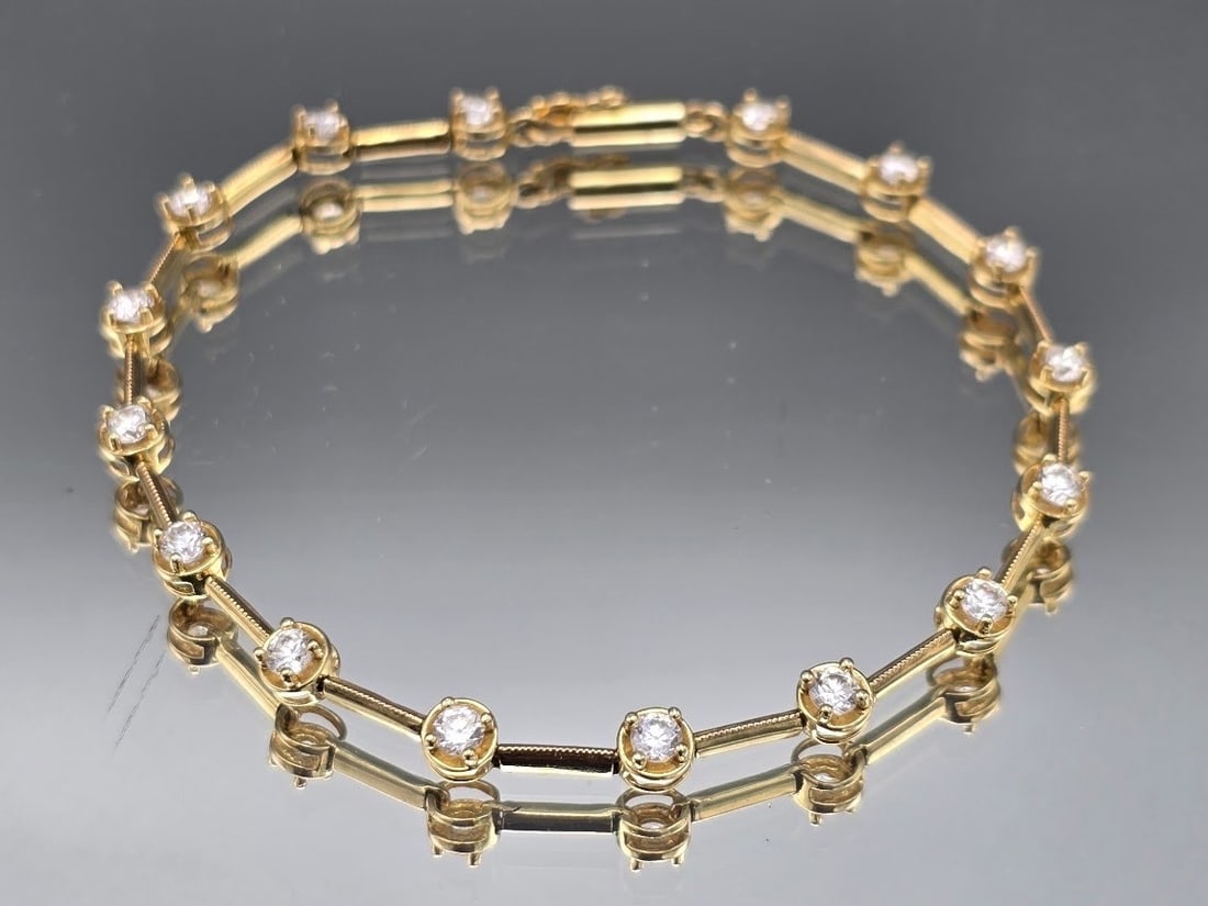 14K Double Bar CZ Tennis Bracelet: A 14K yellow gold double bar tennis bracelet with round cut cubic zirconium stones. Marked 14K. 8in long. 4.82 dwt. | You have additional shipping options, and are not required to use Live Shipping. A
