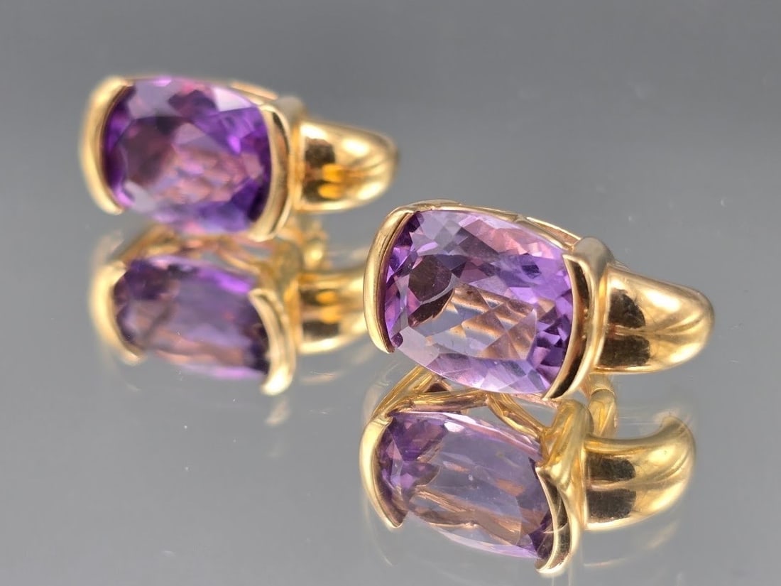 14K Cushion Cut Amethyst Drop Earrings: A pair of 14K yellow gold earrings with cushion cut amethysts. Marked 14K. 5/8in long. 5.46 dwt. | You have additional shipping options, and are not required to use Live Shipping. Additional shipping