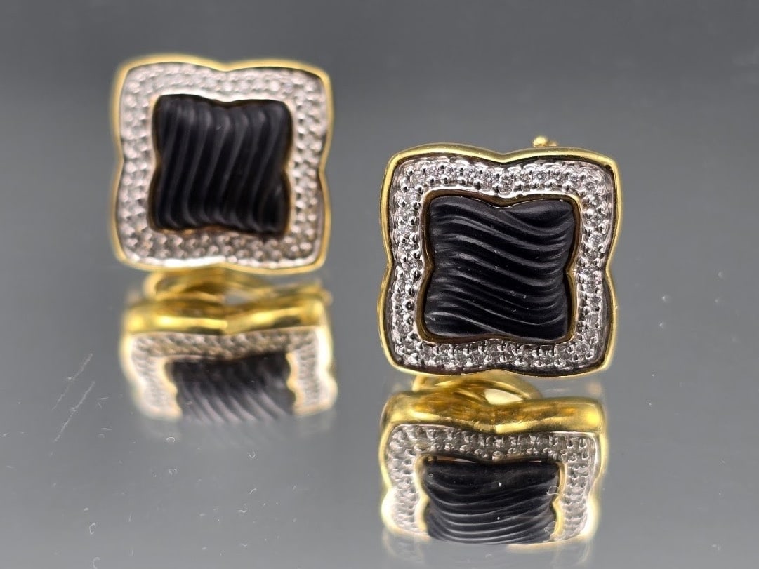 David Yurman 18K Onyx and Diamond Earrings: A pair of David Yurman 18K earrings with carved onyx centers flanked by pave diamonds. Marked "D.Y.". 750. 5/8in tall x 5/8in wide. 12.08 dwt. | You have additional shipping options, and are not