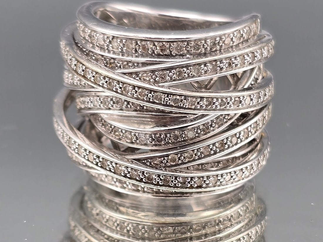 14K Pave Diamond Crossover Ring: A 14K white gold crossover ring with micro-pave diamonds. Marked 14K. Size 6-1/2. 13.95 dwt. | You have additional shipping options, and are not required to use Live Shipping. Additional shipping and