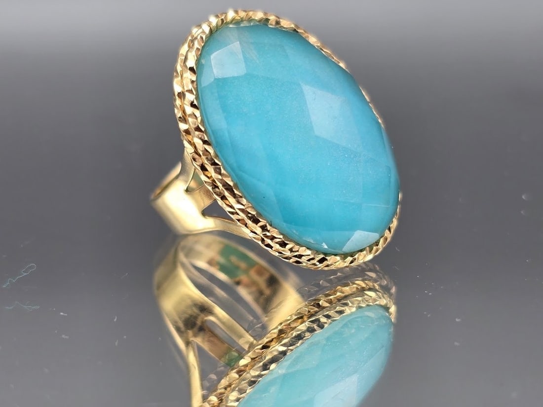 14K Milor Gold Cocktail Ring: A 14K Milor gold cocktail ring with large, faceted blue glass stone. Marked 14K Milor Italy. Ring size 7. 4.62 dwt. | You have additional shipping options, and are not required to use Live Shipping.
