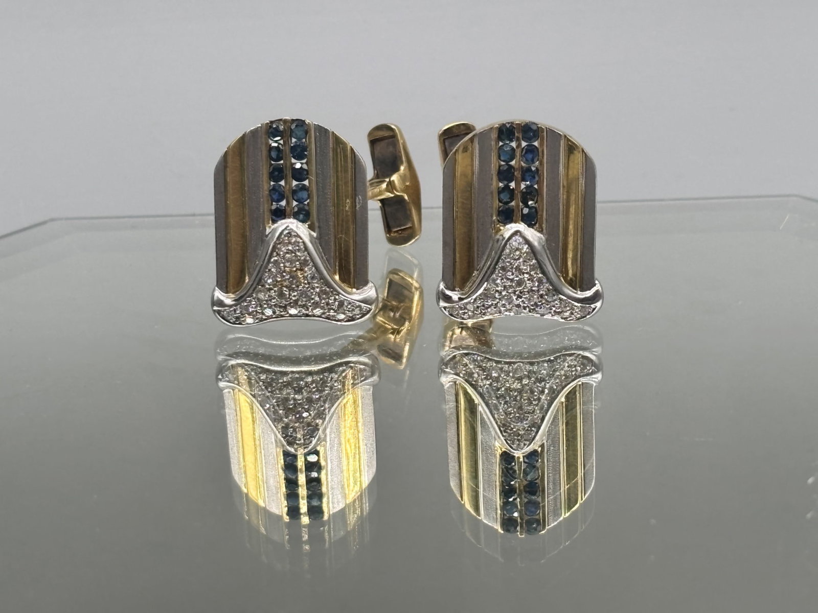 14K Diamond and Blue Topaz Cufflinks: A pair of 14K white and yellow gold cufflinks with pave diamond design and a row of ten sapphire stones. Tests as 14K. 10.54 dwt. | You have additional shipping options, and are not required to use Li