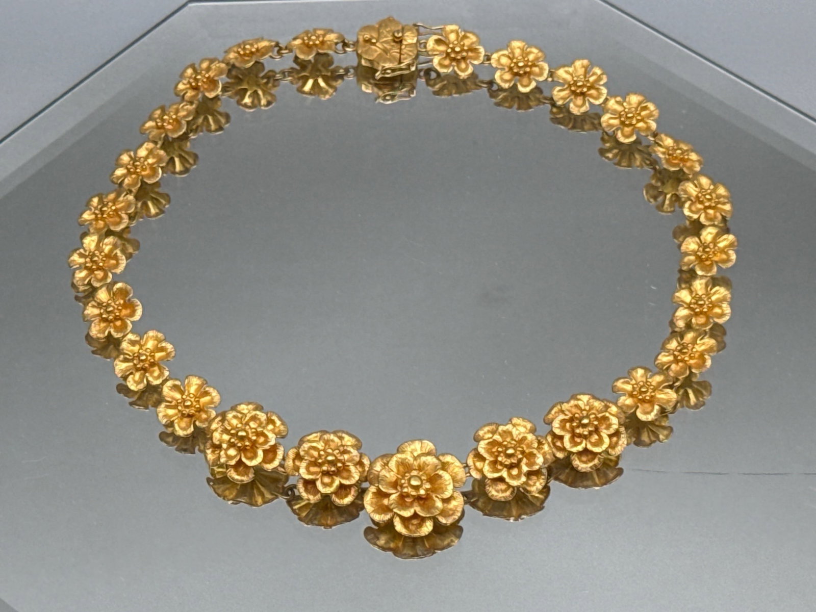 18K Flower Form Collar Necklace: An 18K yellow gold collar necklace with flower form links and clasp. Marked 750. 16in long. 51.57 dwt. | You have additional shipping options, and are not required to use Live Shipping. Additional shi