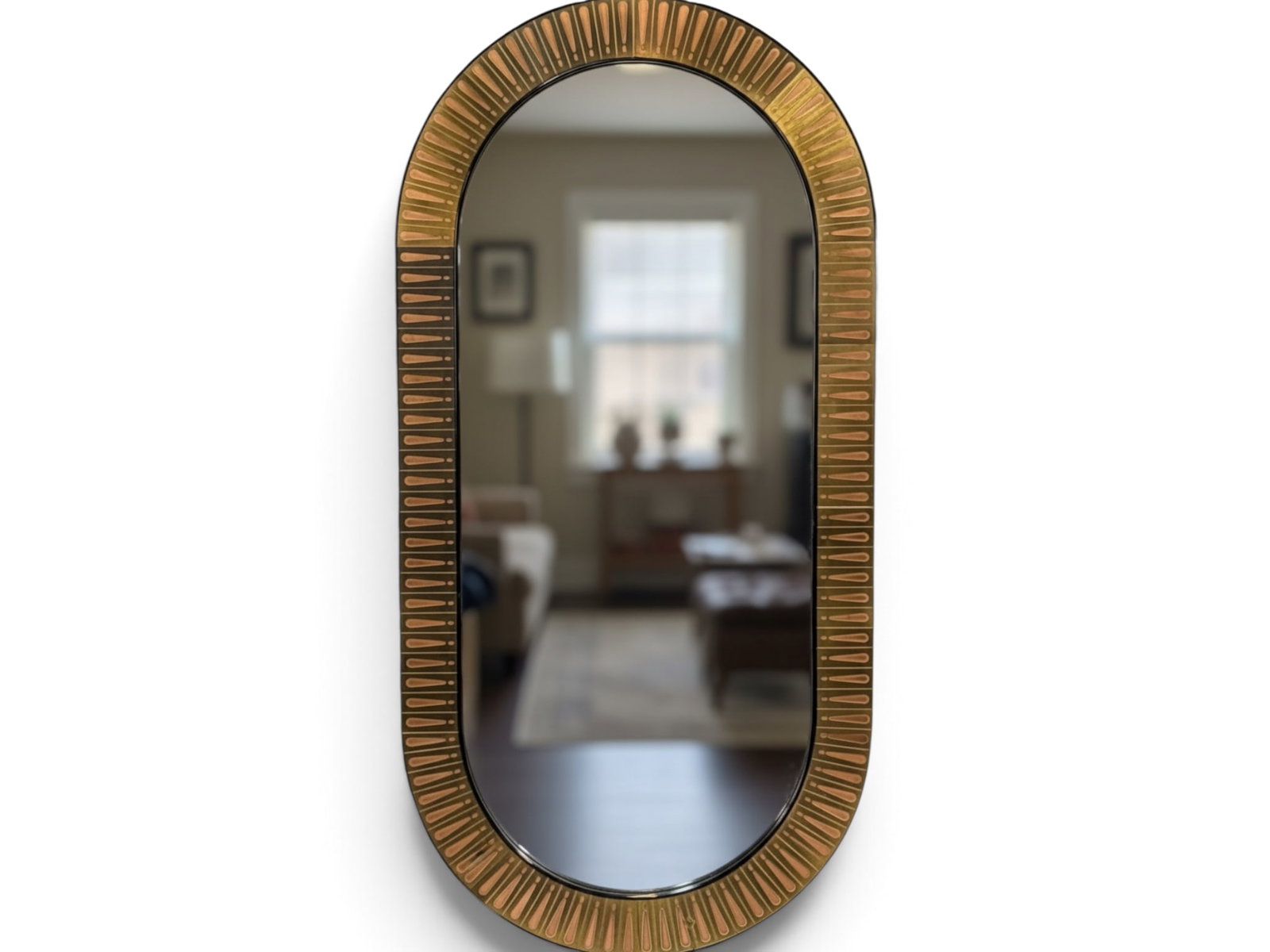 Bijan Signed Brass and Copper Etched Mirror: A Bijan artist-signed copper and brass etched racetrack mirror. Label verso. 36-1/4 in x 18-1/2 in. | You have additional shipping options, and are not required to use Live Shipping. Additional shippi
