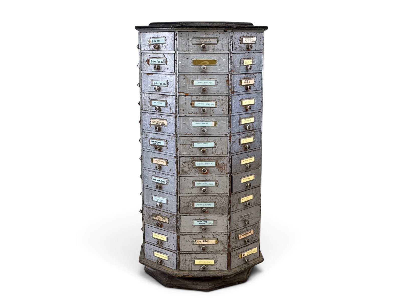 Hardware Store Nut & Bolt Revolving Cabinet: A hardware store revolving nut and bolt cabinet, with a painted silver surface. 41in tall x 20-1/2in wide. | You have additional shipping options, and are not required to use Live Shipping. Additional