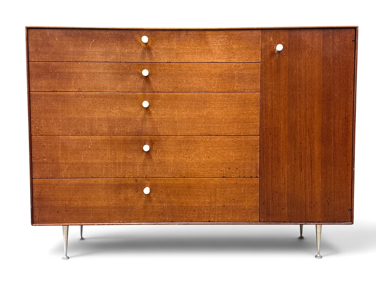 George Nelson Thin Edge Cabinet: A George Nelson for Herman Miller "Thin Edge" walnut cabinet with five drawers next to a cabinet with shelves. Unmarked. Pulls are contemporary reproductions. 41in tall x 56in wide x 20in deep. | You 