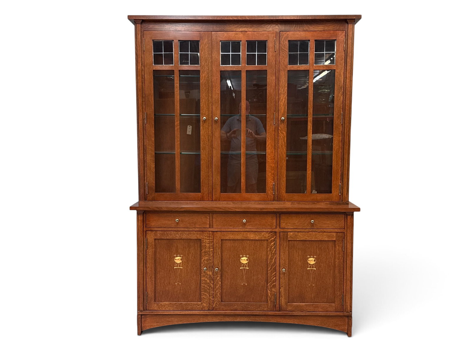 Stickley Harvey Ellis Oak China Cabinet: A Stickley Harvey Ellis Arts & Crafts oak two-part china cabinet with a glass-door top and glass shelves, over a buffet with finely inlaid doors. 82-1/2in tall x 58-1/2in wide x 20-1/4in deep. | You h