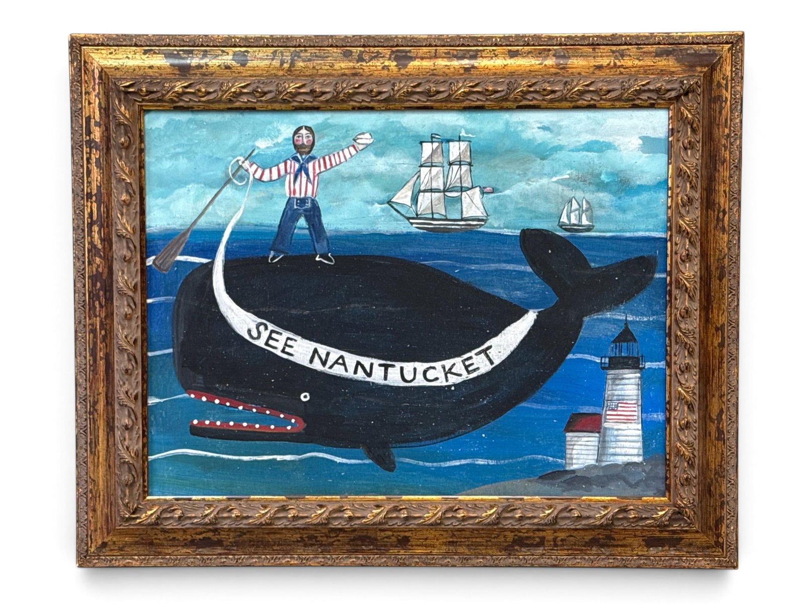 Melinda Kirkpatrick Painting/Panel: See Nantucket: Melinda Kirkpatrick (American, Contemporary). A New England folk art painting on panel depicting a whale with sailor and lighthouse, and a ribbon showing "See Nantucket". Gilt framed. Outside frame: 2